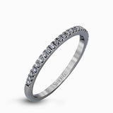 Featuring an eye-catching modern design, this white gold ring is accentuated with a dazzling .50 ctw round cut white diamonds.