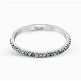 Featuring an eye-catching modern design, this white gold ring is accentuated with a dazzling .50 ctw round cut white diamonds.