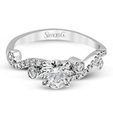 Playful and modern, this white gold wedding set sparkles with .31 ctw of round white diamonds highlighting the center stone.