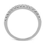 Playful and modern, this white gold wedding set sparkles with .31 ctw of round white diamonds highlighting the center stone.