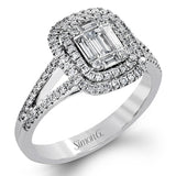 The modern style of this white gold ring is complemented by .44 ctw of glistening baguette cut white diamonds and .36 ctw of round cut white diamonds.