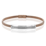 A perfect stacking bangle made of 18K rose gold cable, adorned with a diamond plaque 0.23 ctw. and magnetic closure