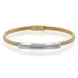 A perfect stacking bangle made of 18K yellow gold cable, adorned with a diamond plaque 0.23 ctw. and magnetic closure