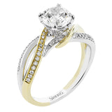 This 18K two-tone engagement ring wraps your finger in twistes bands of white and yellow gold accented with 0.26 ctw. of diamonds