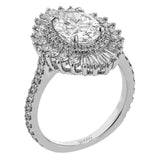 Crafted in 18K gold, this distinctive ring made for an Oval center stone features a halo of round diamonds 0.36 ctw, surrounded by a spray of baguette shaped diamonds 0.30 ctw.