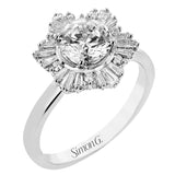 Crafted in 18K polished white gold, this distinctive ring features a halo of round diamonds 0.7 ctw, surrounded by a burst of baguette shaped diamonds 0.45 ctw.