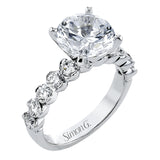 18K diamond engagement ring 0.90 ctw., features a half bezel setting on each individual side diamond which adds a modern bubble look to this ring