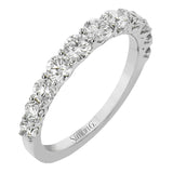 The perfect compliment to your ring, this simple & elegant 18 kt white gold diamond band has 1.10 ctw of round brilliant white diamonds