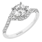 Contemporary 18 kt white gold engagement ring has a subtle knife edge and 2 diamonds of .21 ctw flanking the center, accented with a swirl of round diamonds .27 ctw