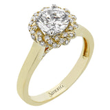 An 18k engagement ring with a new take on the classic solitaire design, features a twisted diamond halo 0.31 ctw., and high polished yellow band