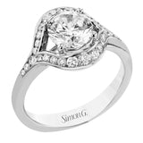 This modern two-tone engagement ring features a uniquely shaped halo with round diamonds of 0.39 ctw.