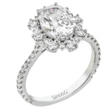 A geometric halo of diamonds in this Supernova Collection engagement ring replicates the effect of a thousand stars.