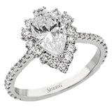 This Supernova Collection engagement ring is built specially for a pear-shaped center stone, with a wonderful halo of diamonds twinkling like starry skies.
