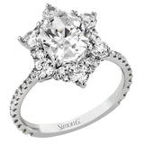 Like a crystallized explosion of light, this remarkable engagement ring design features a supernova of .60 ctw of diamonds surrounding the oval shaped center stone, as well as .38 ctw of smaller diamonds down the band.