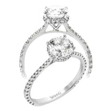 Part of our Underhalo Collection, this engagement ring contains the perfect touch of white diamonds that wink from underneath the center stone setting as well as down the sides of the ring.