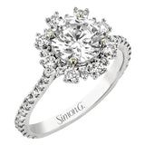 From our Super nova collection this 18K engagement ring is a unique take on the classic halo ring, and features 0.60 ctw of round diamonds