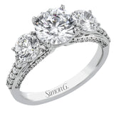 This impressive three stone ring design features a full 1ct total diamond weight on the sides of the center stone, along with .33 ctw of diamonds extending down the sides of the ring.
