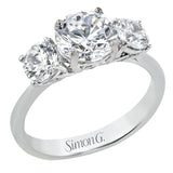 This remarkable engagement ring is our take on a classic three stone, with an intricate side design and 1.00 ctw side diamonds.