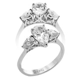 This distinctive three stone ring is new take on a classic style, with .45 ctw of pear shaped side diamonds highlighting the pear shaped center stone.