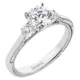 Diamond side stones, milgrain and diamond detailing on the sides of the ring add to the beauty of this unique engagement ring.