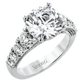 This bold 18K diamond engagement ring features 1.30 ctw of graduated round diamonds along the top & sides
