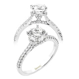 Featuring our new underhalo design, a ring of diamonds sits underneath the center stone in this bridal ring, giving a remarkable side view.