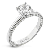 While lines of diamonds extending down both sides of this engagement ring, the round center stone is enhanced by the pure beauty of the 18k white gold on top.