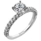 This engagement ring is sure to shine, with a classic straight design set with .49 ctw of white side diamonds.