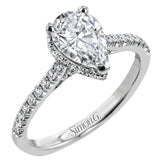 A hidden underhalo of brilliant diamonds reveals itself when this ring is turned to side, diamonds shining from every angle.