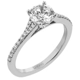 Simple yet stunning, this graceful engagement ring is made for a round cut center stone and is set with .16 ctw of white diamonds.