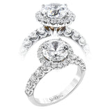 This stunThis stunning halo engagement ring in 18K white gold takes a 2.0 ct center, and has 0.92 ctw of RD brilliant diamonds on the sides & the halo combined.