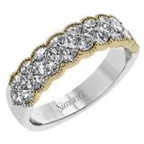This exquisite band is perfect as an anniversary band or as a right hand ring, featuring 1.09 ctw of princess cut diamonds with touches of yellow gold along the outside.