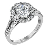 This delightful engagement ring features a scalloped halo that surrounds the center stone like a flower, containing .52 ctw of white diamonds.