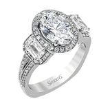 This impressive white gold ring features .43 ctw emerald cut side diamonds and is accented with .38 ctw round cut diamonds.