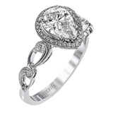 Reflecting a lovely romantic design, this white gold classic engagement ring features .16 ctw round cut white diamond accents.