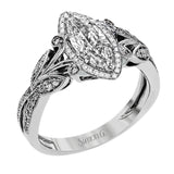 This amazing 18k white gold engagement ring features vintage-inspired design elements set with .28 ctw of white diamonds.