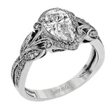 This amazing 18k white gold engagement ring features vintage-inspired design elements set with .28 ctw of white diamonds.