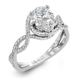 Classic with a modern twist, this white gold engagement ring features .50 ctw of sparkling white diamonds in a dramatic openwork design.