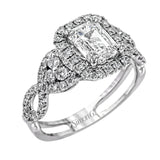 Reflecting an intricate modern design, this remarkable white gold ring is emphasized by a lovely halo complemented with .59 ctw round cut white diamonds.
