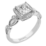 Reflecting a lovely romantic design, this white gold classic engagement ring features .16 ctw round cut white diamond accents.