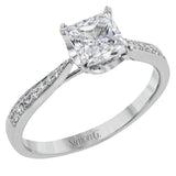 The delicate, understated design of this lovely white gold ring is elevated by .27 ctw of round white diamond accents.