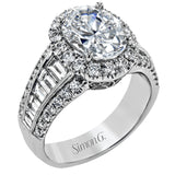 This gorgeous engagement ring makes quite the appearance with .83 ctw of round diamonds along with .83 ctw of baguette diamonds.