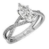 This sparkling modern white gold engagement ring and wedding band set features an eye-catching twisted design accented by .22 ctw of shimmering round cut white diamonds.
