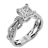 This impressive contemporary white engagement ring features a unique twisting design on the shank, which is complemented by .17 ctw of round cut white diamonds.