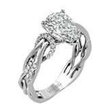 This impressive contemporary white engagement ring features a unique twisting design on the shank, which is complemented by .17 ctw of round cut white diamonds.