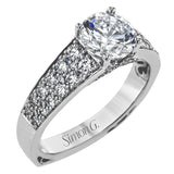 This elegant diamond engagement ring from our Simon Set collection shimmers with 0.70 ctw of brilliant white diamonds in a cathedral setting & on the profile.