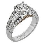 This distinctive ring features a center row of .75 ctw of baguette diamonds outlined on either side by .43 ctw of round diamonds.