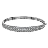 This three-row 18k white gold bangle bracelet is sure to turn heads with 5.42 ctw of white diamonds.