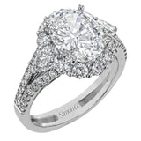 This glamorous white gold ring features 1.01 ctw of round white diamonds and .62 ctw of pear shaped white diamonds as a dazzling backdrop for the center stone