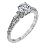 This remarkable white gold ring features .18 ctw of round white diamonds and delicate milgrain edging for a sleek, romantic look.